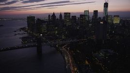 4K aerial stock footage approaching Lower Manhattan skyline, New York, New York, twilight Aerial Stock Footage | AX89_123