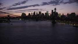 4K aerial stock footage Approaching Manhattan Bridge, Lower Manhattan skyline, New York, twilight Aerial Stock Footage | AX89_128