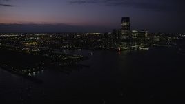 4K aerial stock footage Panning right to Goldman Sachs Tower, Downtown, Jersey City, New Jersey, twilight Aerial Stock Footage | AX89_136