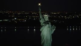 4K aerial stock footage Flying by Statue of Liberty, New York Harbor, New York, New York, night Aerial Stock Footage | AX89_148