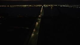 4K aerial stock footage Flying by Newark Bay Bridge, Newark, New Jersey, night Aerial Stock Footage | AX89_153