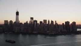 4K aerial stock footage Approaching Lower Manhattan skyline, New York, New York, sunrise Aerial Stock Footage | AX90_003