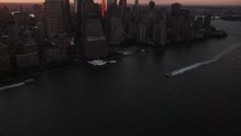 4K aerial stock footage Tilting up to reveal World Trade Center, Lower Manhattan, New York, sunrise Aerial Stock Footage | AX90_007