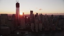 4K aerial stock footage Flying by Lower Manhattan skyscrapers, New York, New York, sunrise Aerial Stock Footage | AX90_009