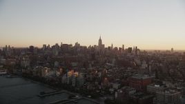 4K aerial stock footage Flying by Midtown Manhattan skyline, Hudson River, New York, New York, sunrise Aerial Stock Footage | AX90_026