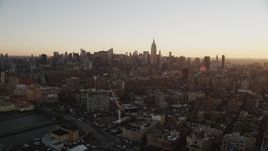 4K aerial stock footage Flying by Midtown Manhattan, seen from Chelsea, New York, New York, sunrise Aerial Stock Footage | AX90_027