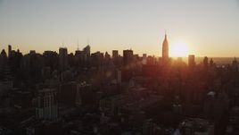 4K aerial stock footage of the Empire State Building, Midtown Manhattan, New York, New York, sunrise Aerial Stock Footage | AX90_030
