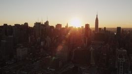 4K aerial stock footage of the Empire State Building, Midtown Manhattan, New York, New York, sunrise Aerial Stock Footage | AX90_031