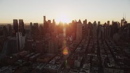 Flying by Midtown Manhattan, New York, New York, sunrise Aerial Stock Footage | AX90_033