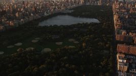 4K aerial stock footage Flying over Central Park, approaching Midtown, New York, New York, sunrise Aerial Stock Footage | AX90_038