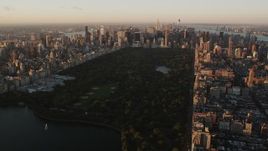 Flying over Central Park, approaching Midtown Manhattan, New York, sunrise Aerial Stock Footage | AX90_040