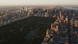 4K aerial stock footage Flying by Central Park, approaching Midtown Manhattan, New York, sunrise Aerial Stock Footage | AX90_042