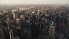 4K aerial stock footage Flying by Midtown Manhattan, Empire State Building, New York, sunrise Aerial Stock Footage | AX90_046