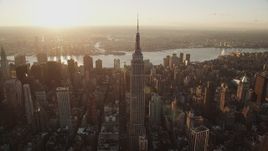 4K aerial stock footage Flying by Empire State Building, Midtown Manhattan, New York, sunrise Aerial Stock Footage | AX90_050