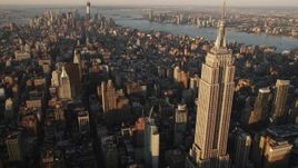 4K aerial stock footage Flying by Empire State Building, Midtown Manhattan, New York, sunrise Aerial Stock Footage | AX90_058