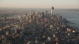 4K aerial stock footage Flying by Lower Manhattan, seen from Midtown, New York, New York, sunrise Aerial Stock Footage | AX90_062