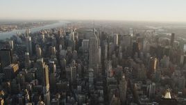 4K aerial stock footage Approaching Empire State Building, Midtown Manhattan, New York, sunrise Aerial Stock Footage | AX90_068