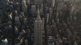 4K aerial stock footage Approaching Empire State Building, Midtown Manhattan, New York, sunrise Aerial Stock Footage | AX90_071