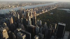 Flying by Midtown Manhattan skyscraper, New York, New York, sunrise Aerial Stock Footage | AX90_076