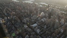 4K aerial stock footage Panning left across Upper East Side, reveal Central Park, New York, New York, sunrise Aerial Stock Footage | AX90_079