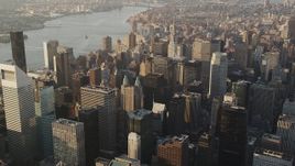 4K aerial stock footage Panning left by Midtown Manhattan skyscrapers, New York, New York, sunrise Aerial Stock Footage | AX90_082