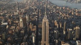 4K aerial stock footage Approaching Empire State Building, Midtown Manhattan, New York, sunrise Aerial Stock Footage | AX90_086