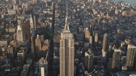 4K aerial stock footage Approaching Empire State Building, Midtown Manhattan, New York, sunrise Aerial Stock Footage | AX90_087