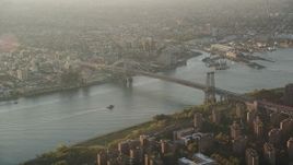4K aerial stock footage Approaching Williamsburg Bridge, East River, New York, New York, sunrise Aerial Stock Footage | AX90_091
