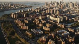 4K aerial stock footage of Public housing, Lower East Side, Williamsburg Bridge, New York, sunrise Aerial Stock Footage | AX90_095