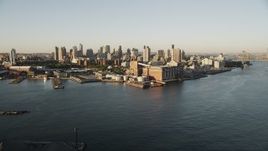4K aerial stock footage Approaching a Brooklyn power plant, East River, New York, New York, sunrise Aerial Stock Footage | AX90_098