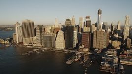 4K aerial stock footage Flying by skyscrapers, East River, Lower Manhattan, New York, sunrise Aerial Stock Footage | AX90_102