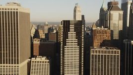 4K aerial stock footage Flying by Lower Manhattan skyscrapers, East River, New York, New York, sunrise  Aerial Stock Footage | AX90_104
