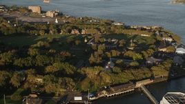 4K aerial stock footage Flying by Fort Jay, Governors Island, New York Harbor, New York, sunrise Aerial Stock Footage | AX90_108