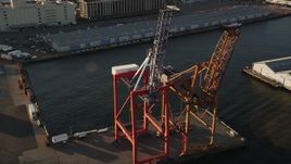 4K aerial stock footage Flying by cargo cranes, Brooklyn Cruise Terminal, Brooklyn, New York, sunrise Aerial Stock Footage | AX90_110