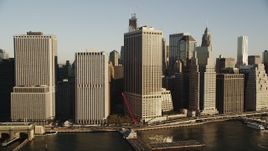 4K aerial stock footage Approaching Lower Manhattan skyscrapers, New York, New York, sunrise Aerial Stock Footage | AX90_114