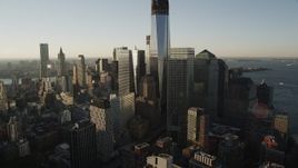 4K aerial stock footage Flying by World Trade Center, Lower Manhattan, New York, New York, sunrise Aerial Stock Footage | AX90_122