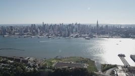 4K aerial stock footage of the Midtown Manhattan skyline and Hudson River in New York seen from Union City, New Jersey Aerial Stock Footage | AX91_004