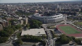 4K aerial stock footage tilt from Macombs Dam Bridge, reveal Yankee Stadium, The Bronx, New York Aerial Stock Footage | AX91_018
