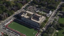 4K aerial stock footage approach Christopher Columbus High School and tilt to a bird's eye view of the building, The Bronx, New York Aerial Stock Footage | AX91_024