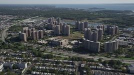 4K aerial stock footage of approaching Harry S. Truman High School and Co-op City apartment buildings, The Bronx, New York Aerial Stock Footage | AX91_025