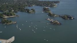 4K aerial stock footage of flying by sailboats and oceanfront mansion on a tiny island, New Rochelle, New York Aerial Stock Footage | AX91_032