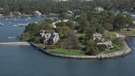 4K aerial stock footage of approaching oceanfront mansions in Mamaroneck, New York Aerial Stock Footage | AX91_036