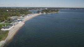 4K aerial stock footage of flying by the beach and coastal neighborhoods in Rye, New York Aerial Stock Footage | AX91_053