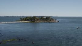 4K aerial stock footage of approaching lighthouse on Great Captain Island, Greenwich, Connecticut Aerial Stock Footage | AX91_056