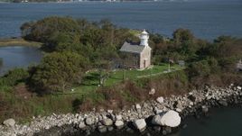 4K aerial stock footage of approaching the lighthouse on Great Captain Island, Greenwich, Connecticut Aerial Stock Footage | AX91_057