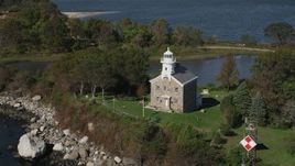 4K aerial stock footage of orbiting lighthouse on Great Captain Island, Greenwich, Connecticut Aerial Stock Footage | AX91_058