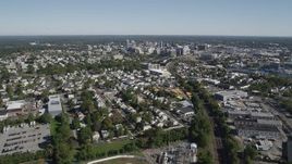 4K aerial stock footage of following railroad tracks to approach Downtown Stamford, Connecticut Aerial Stock Footage | AX91_071