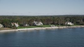 4K aerial stock footage of flying by beachfront mansions on the shore, Westport, Connecticut Aerial Stock Footage | AX91_107