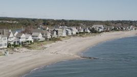 4K aerial stock footage of passing by a row of beachfront homes, Fairfield, Connecticut Aerial Stock Footage | AX91_113