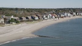 4K aerial stock footage of flying by a row of beachfront homes, Fairfield, Connecticut Aerial Stock Footage | AX91_114
